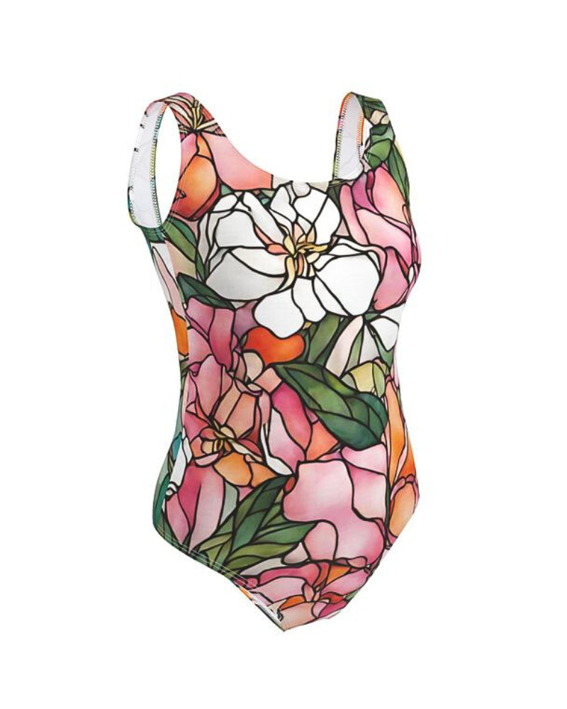 Illuminate your surroundings with the Blooming Bright print. Inspired by the transformative beauty of stained glass, this design features vibrant azaleas and hibiscus flowers in shades of pink, orange, and white, surrounded by lush green leaves. Each element showcases the power of transformation, ensuring you radiate confidence and elegance wherever you go.